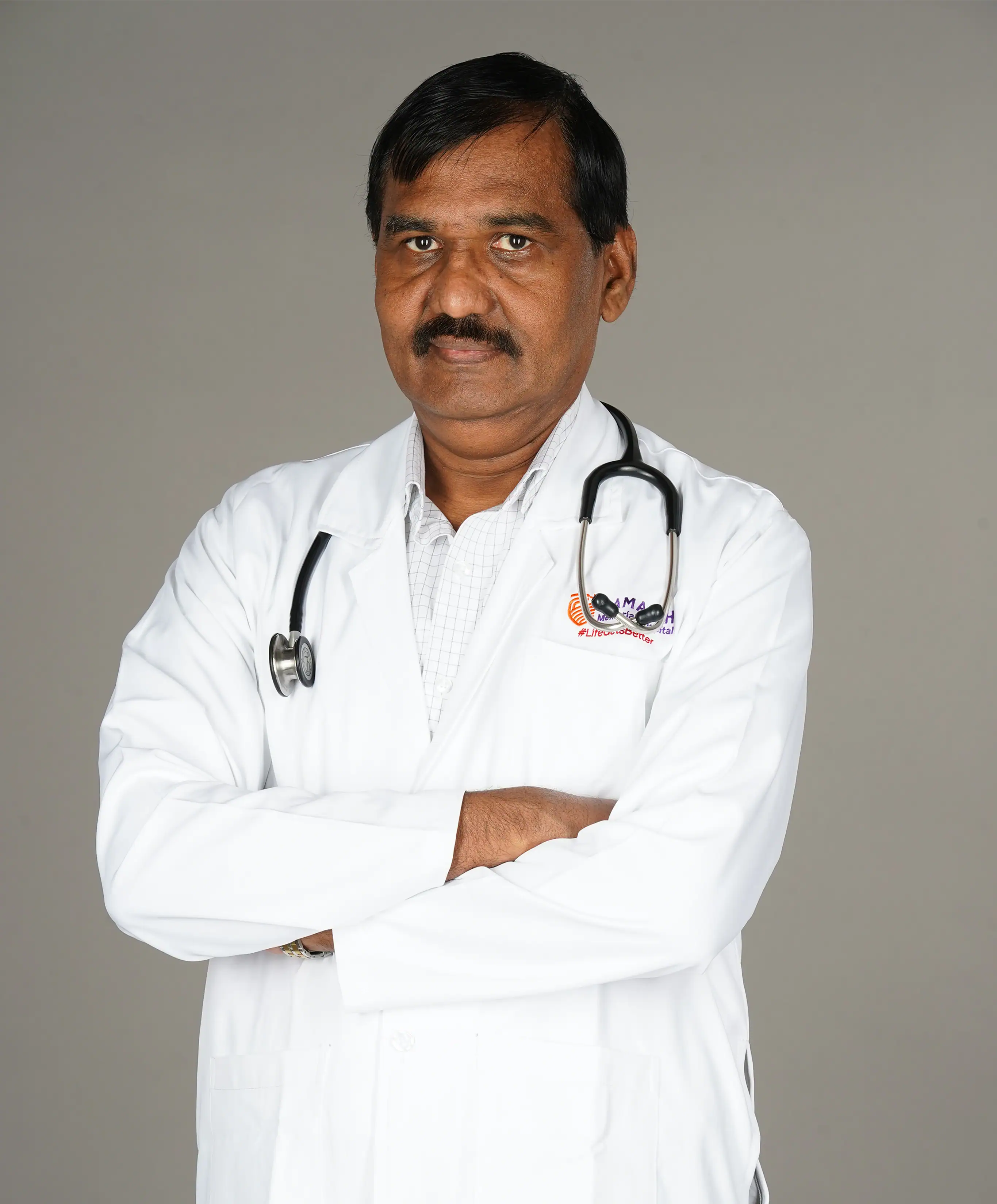 Dr. Mahesh E