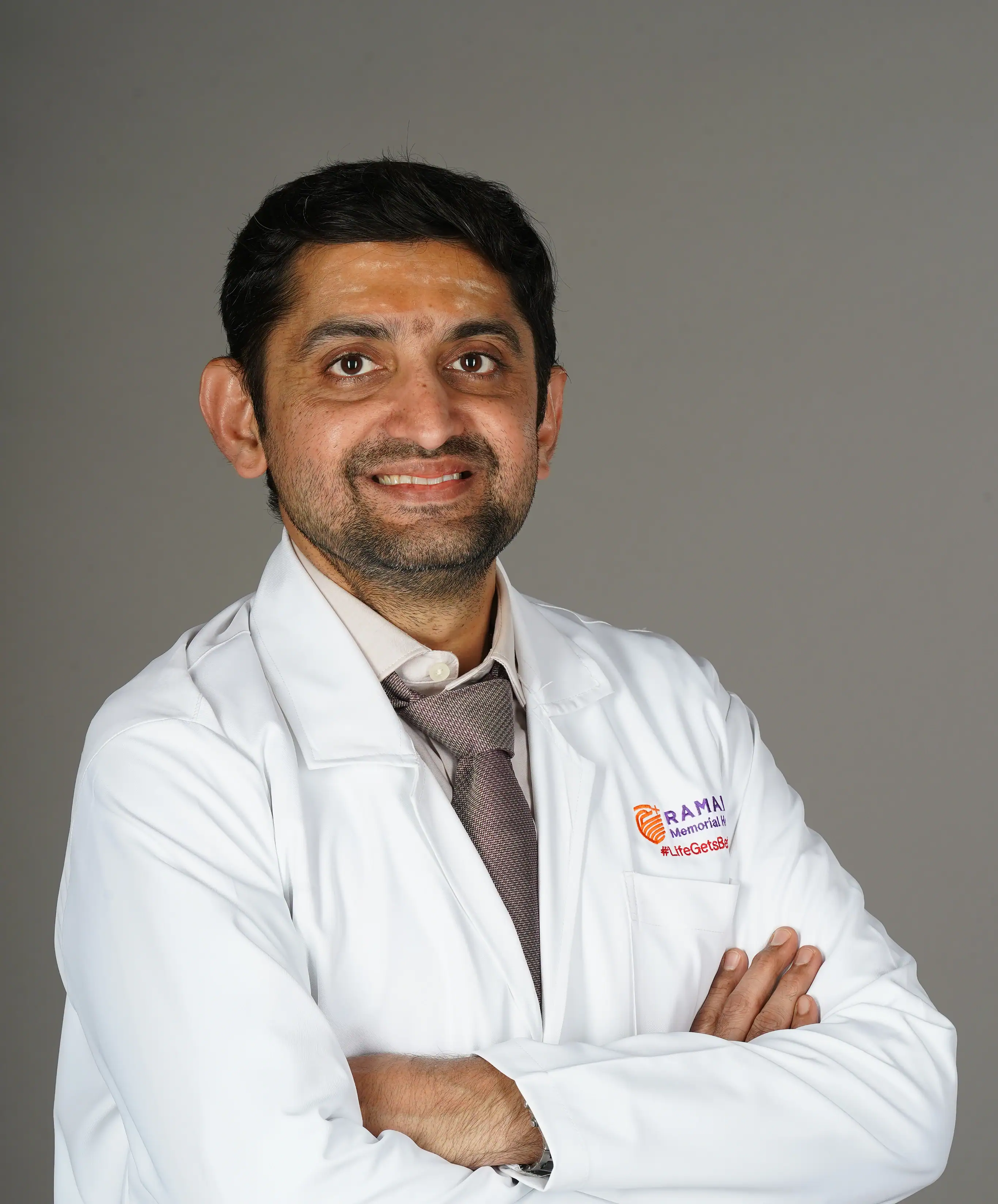 Dr. Avinash B