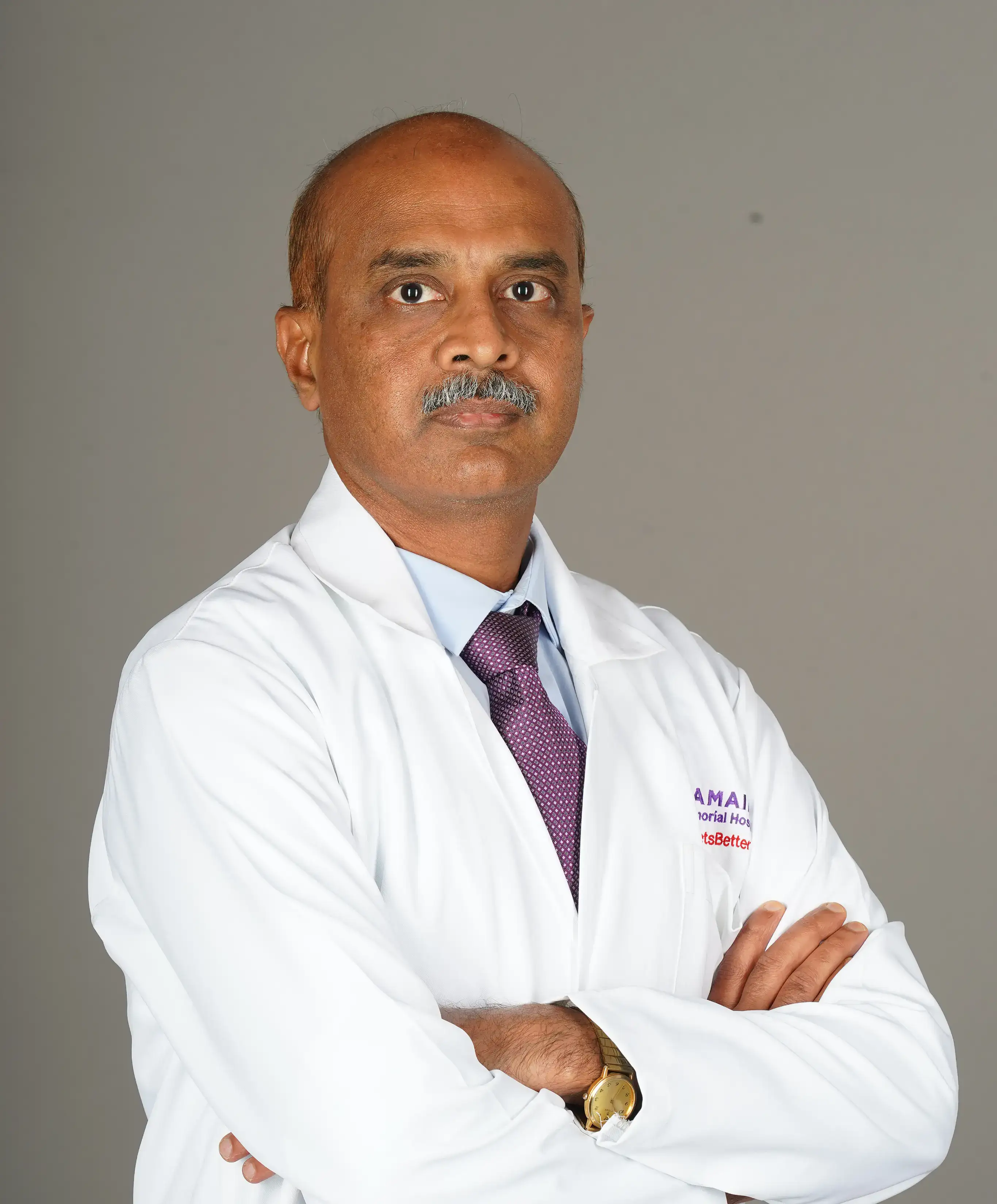 Dr. Tejesh C A